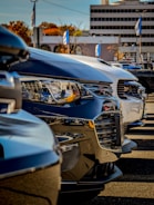 Multiple company cars lined up for annual inspection.