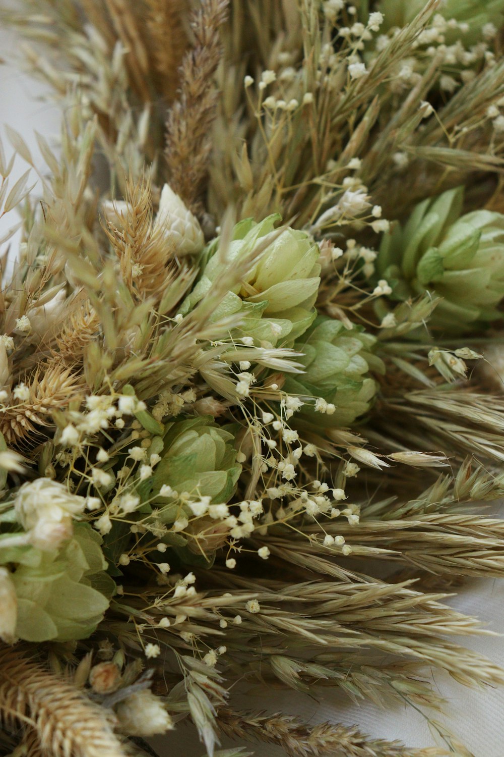 a bunch of dried flowers sitting on top of a table