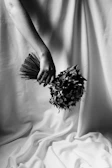 Artistic shot of a premium Mexican flower bouquet with minimalist beige and black background.