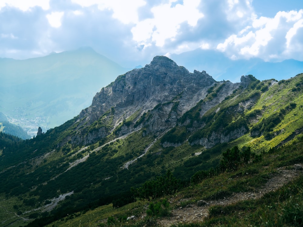 a view of a mountain range from a trail