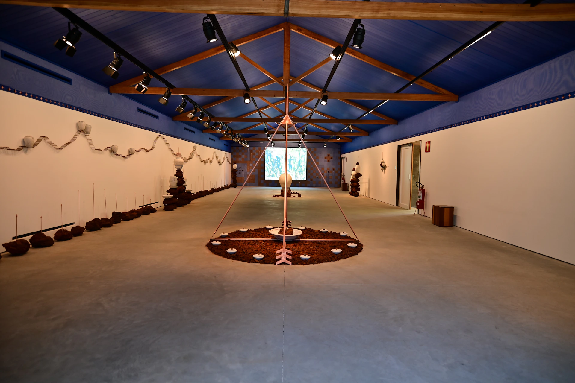 woman wearing yellow long-sleeved dress under white clouds and blue sky during daytime