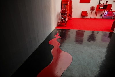 Red and black themed storage unit exterior in Zaragoza neighborhood.