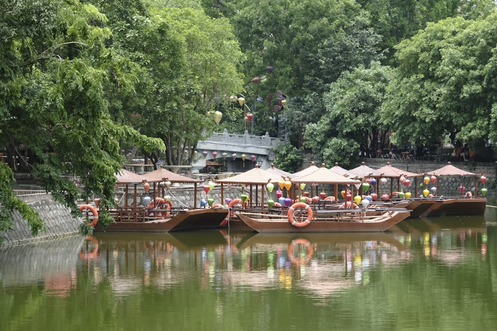 a group of boats floating on top of a river