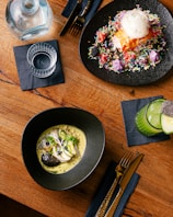 A vibrant dish of freshly prepared gourmet food on a rustic wooden table.
