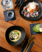 Close-up photo of Scandinavian-style dishes artfully arranged on a rustic wooden table.