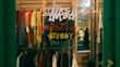 a store window with a sign that says shop