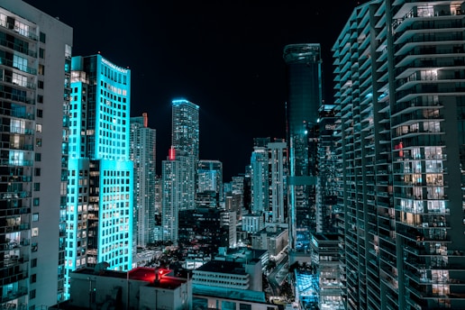 a view of a city at night from the top of a building