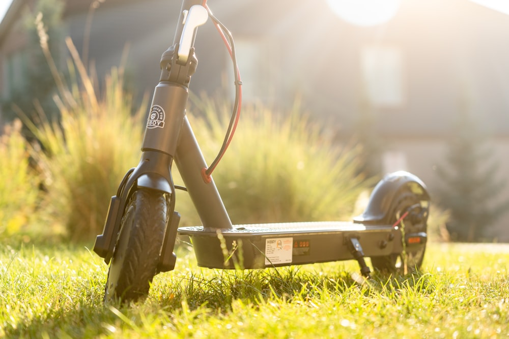 a close up of a scooter in the grass