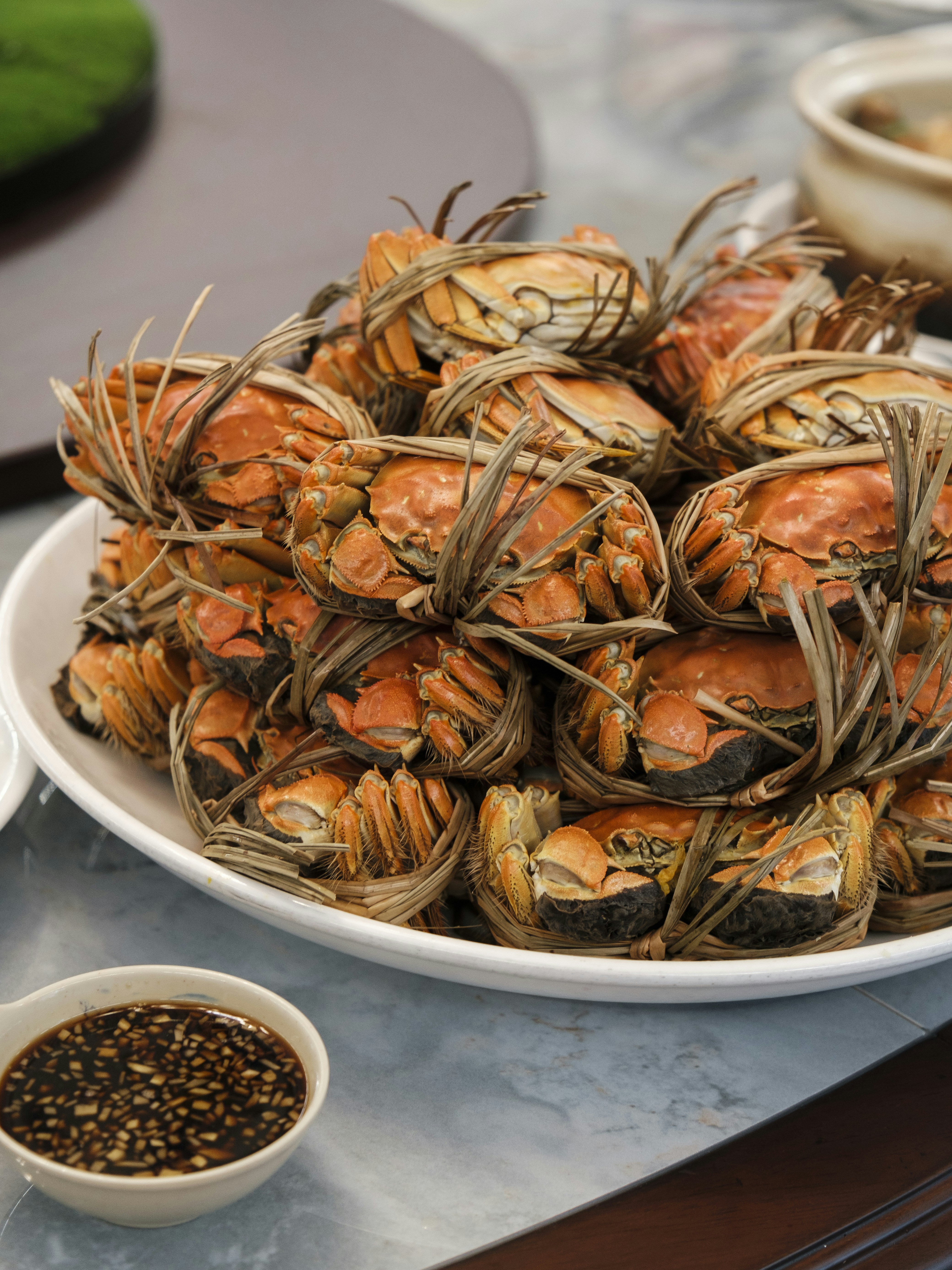 a plate full of cooked crabs on a table