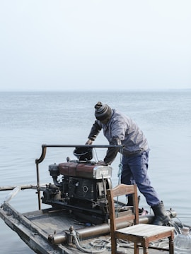 Yamaha outboard motor with cowling removed for maintenance.