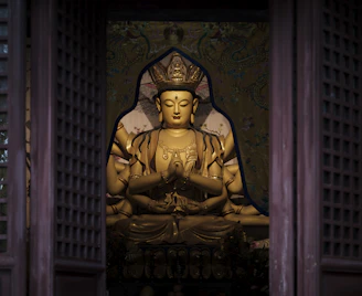 A serene brass Lakshmi murti placed in a home temple setting with soft lighting.