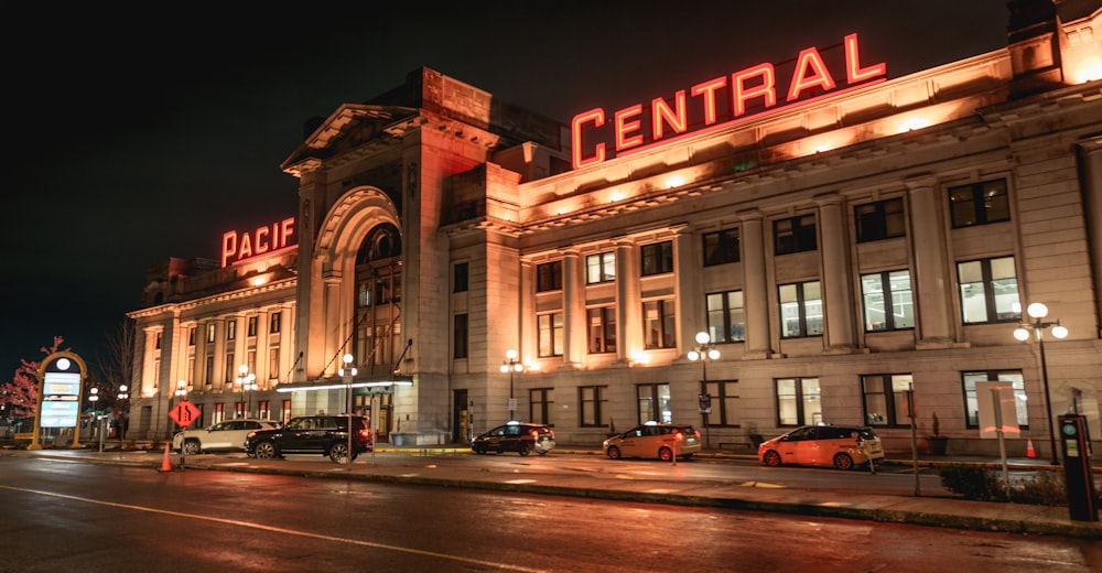 a large building with a neon sign on top of it