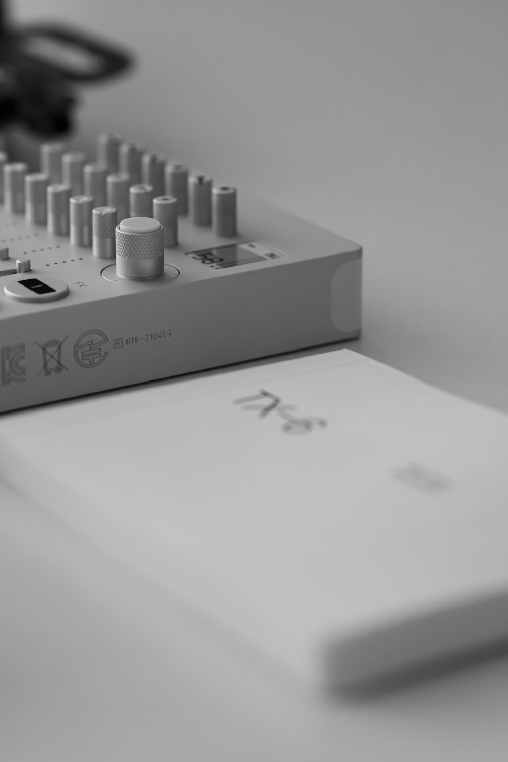 a close up of a sound board and a pair of eyeglasses