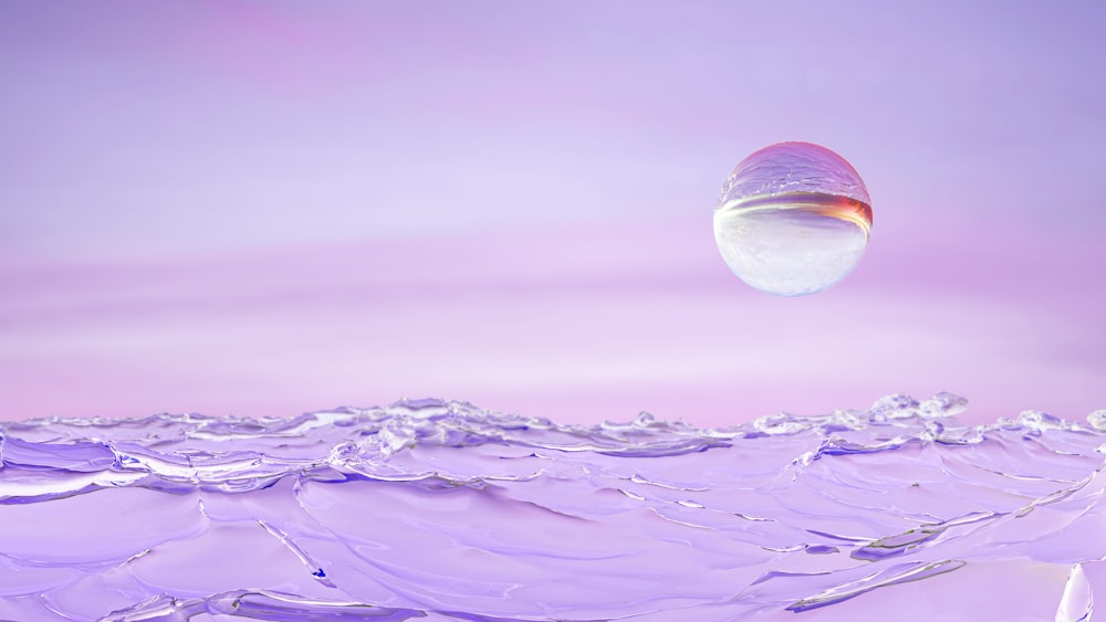 an abstract photo of water and a pink sky