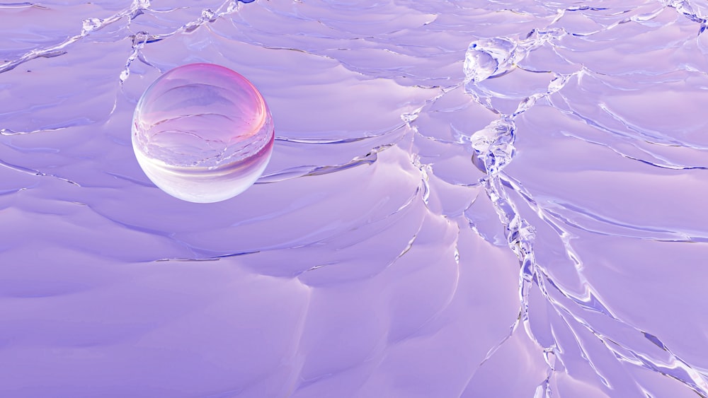 a pink object floating on top of a body of water