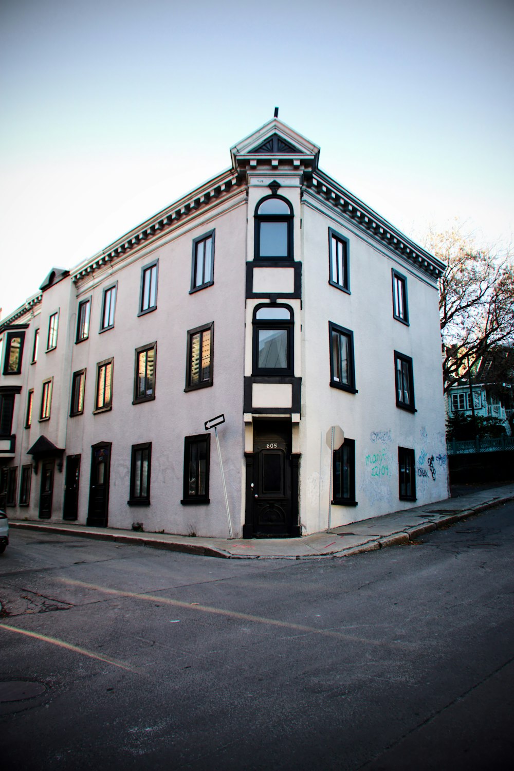 a white building with black trim and windows