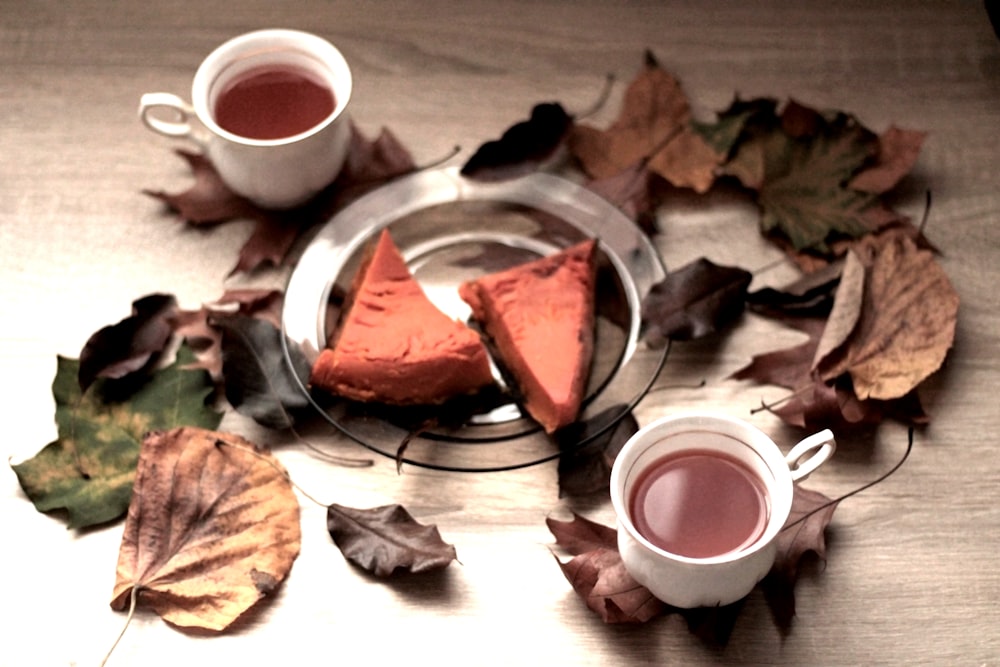 a plate with a piece of pie and a cup of tea