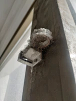 Dusty and stained roller blind before cleaning, showing visible dirt and grime.