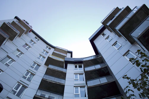 Horizontal image of a modern apartment with large windows and city view