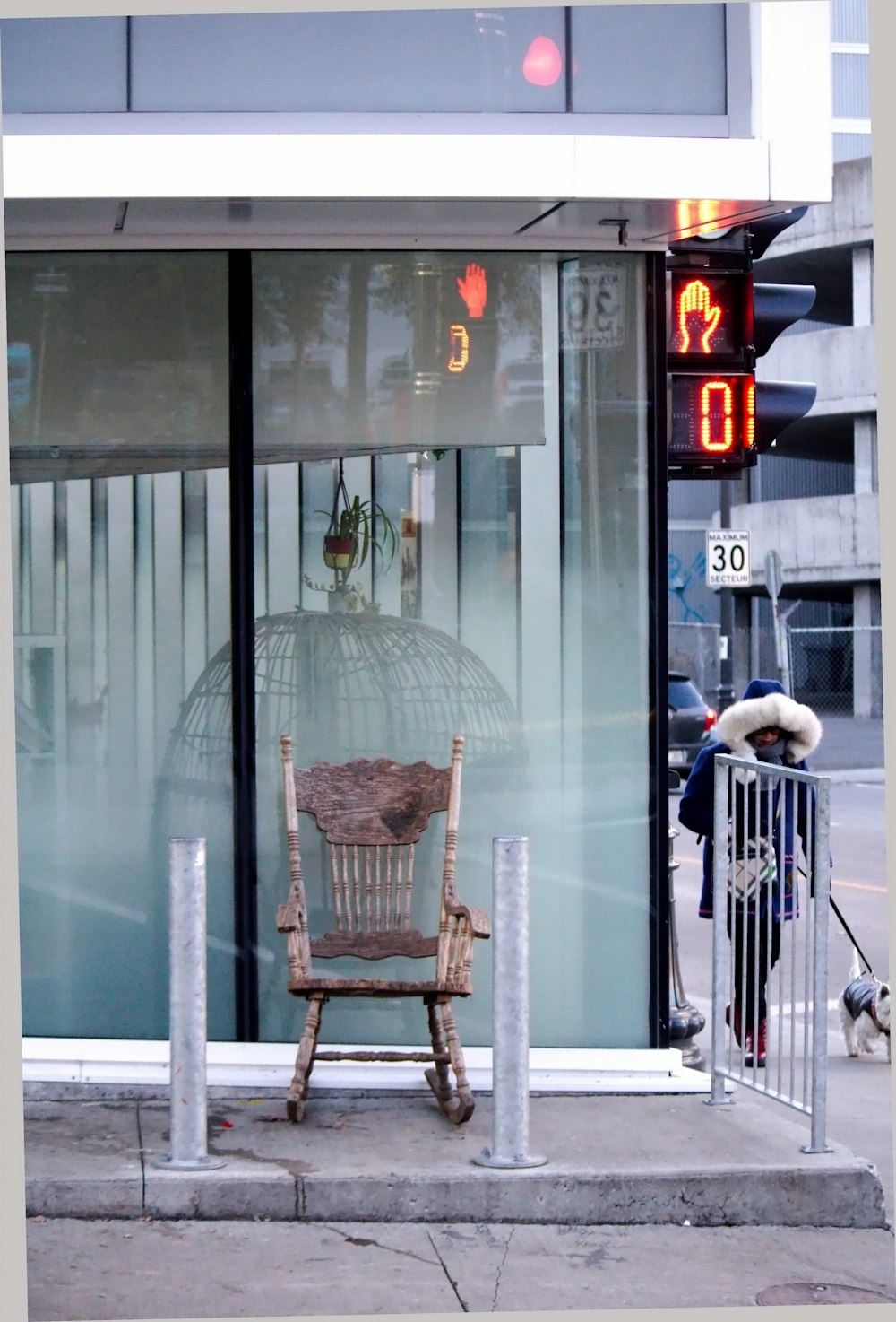 a wooden chair sitting in front of a window