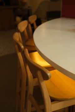 a close up of a table with chairs around it
