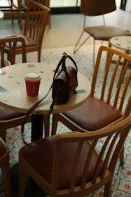 A designer discussing ideas over coffee in a cozy studio space.