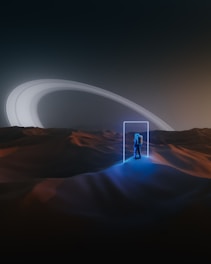 An astronaut stands in an alien desert landscape, illuminated by a glowing, rectangular portal. The terrain is softly lit with hues of blue and orange, and in the distance, the rings of a large planet arc across the sky under an eerie, futuristic glow.