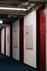 Hallway lined with student artwork and bulletin boards filled with campus events.