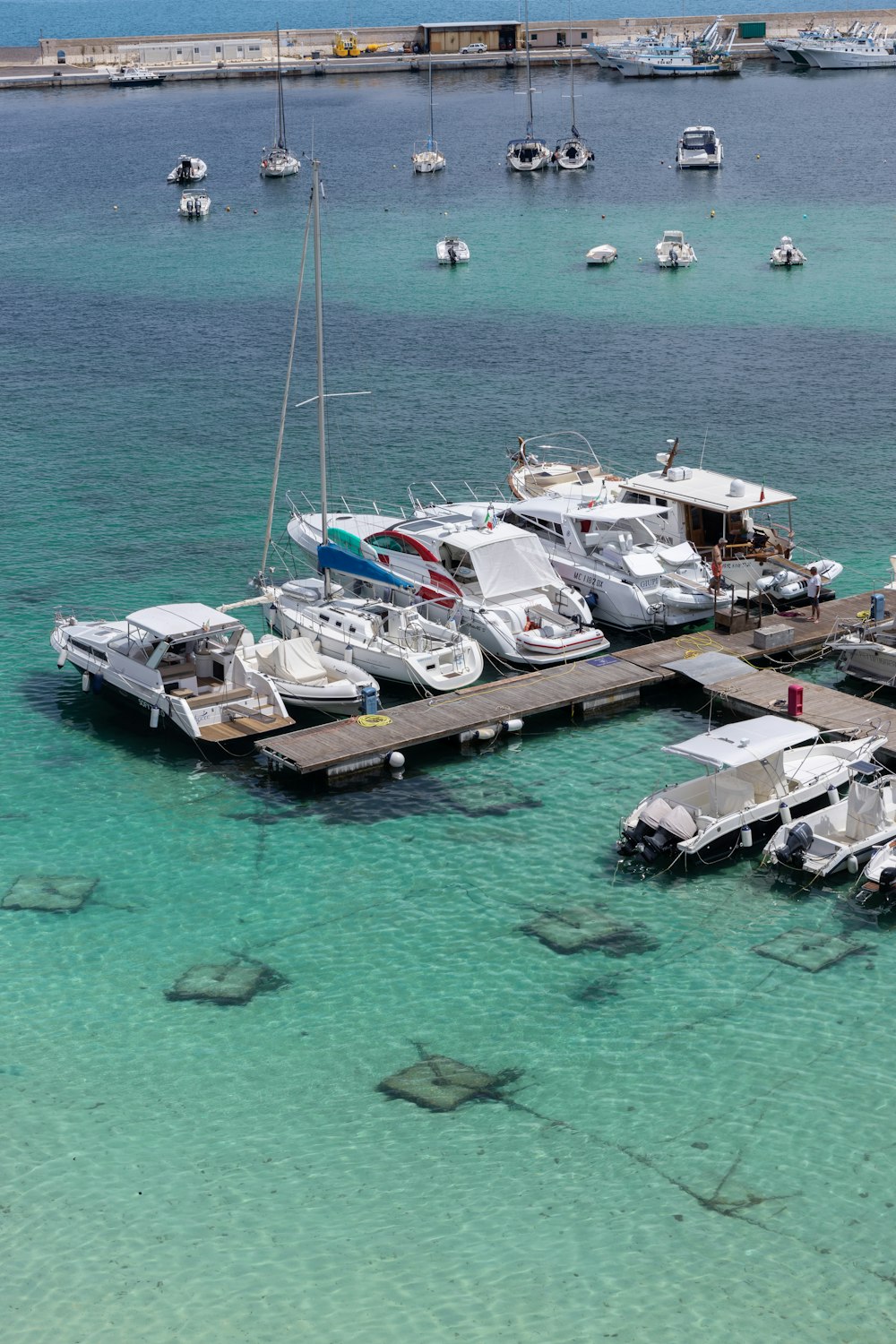 a group of boats that are sitting in the water