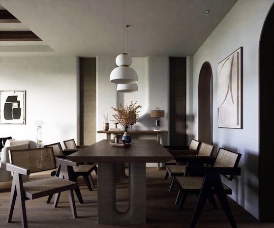 Minimalist dining space with clean lines, a sleek wooden table, and modern chairs accented by a vibrant abstract centerpiece.