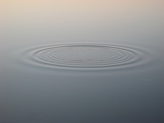 Diagram illustrating gravitational radiation waves propagating outward.