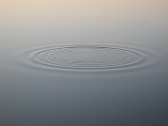 A softly glowing timeline diagram illustrating ripple effects from a small change in history.