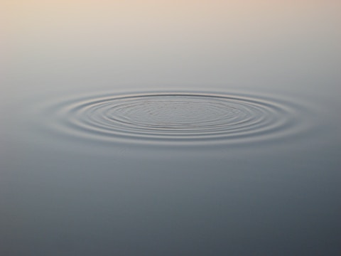 Diagram illustrating gravitational radiation waves propagating outward.