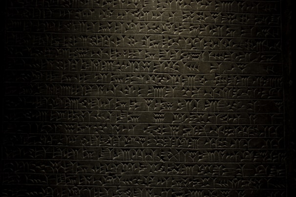 A detailed shot of Moses holding stone tablets with ancient Hebrew carvings.