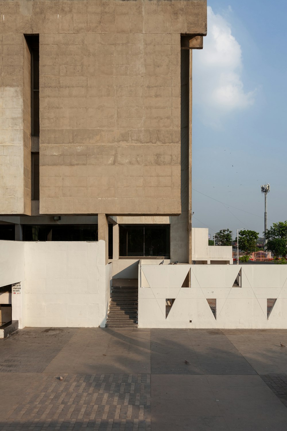 an empty parking lot in front of a building