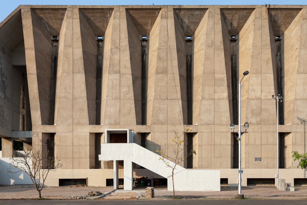 a large building with a staircase in front of it