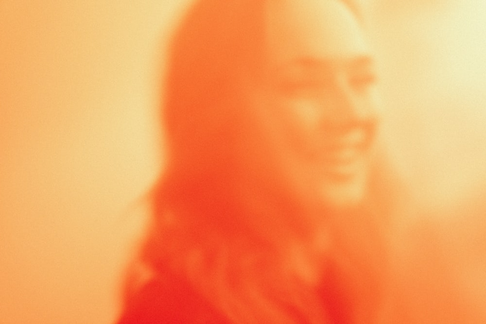 a blurry photo of a woman with long hair