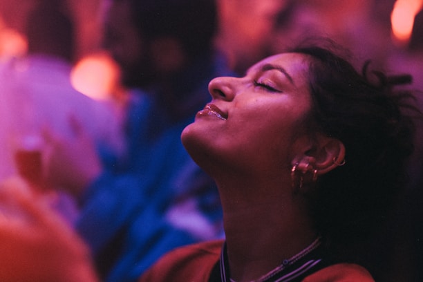 A close-up of a glowing face during a yoga practice, radiating calm and confidence.