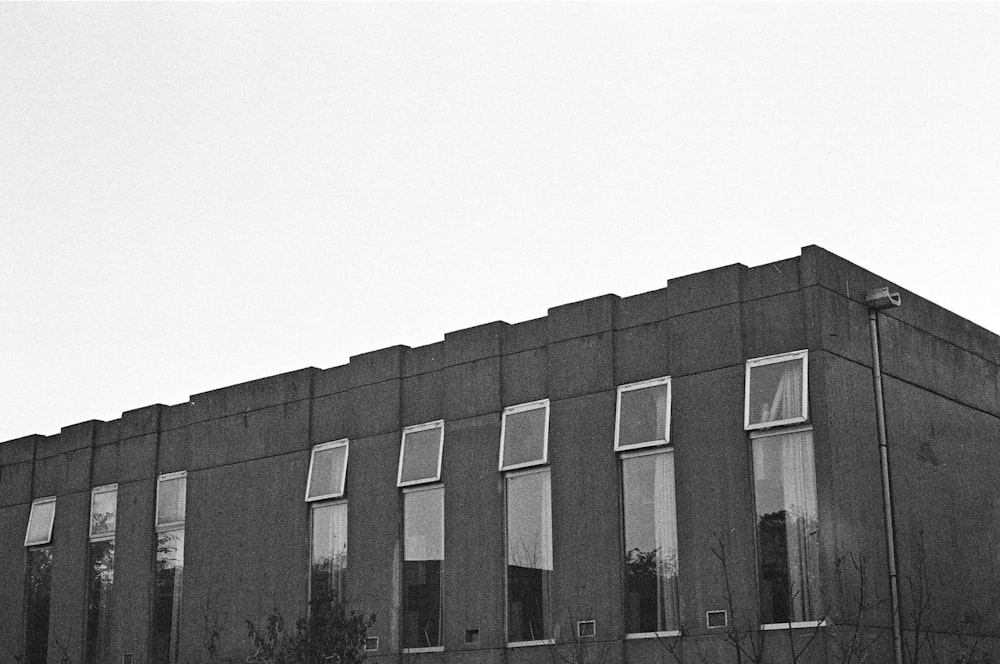 a black and white photo of a building with windows