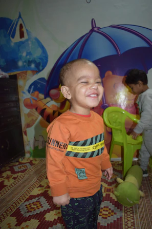 Smiling children enjoying the safe and vibrant Kids Zone environment in Marrakech.