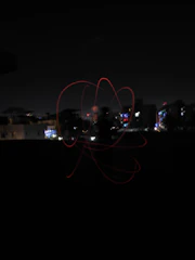 Nighttime cityscape with subtle light trails representing connections.