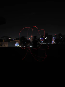 Nighttime cityscape with subtle light trails representing connections.