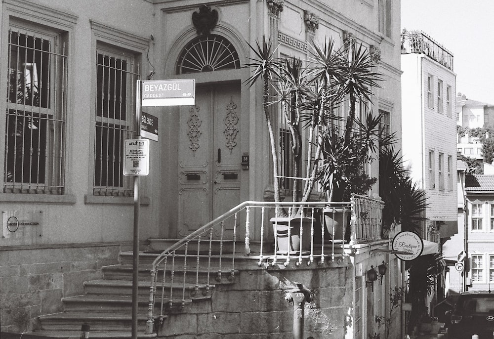a black and white photo of a building with a staircase