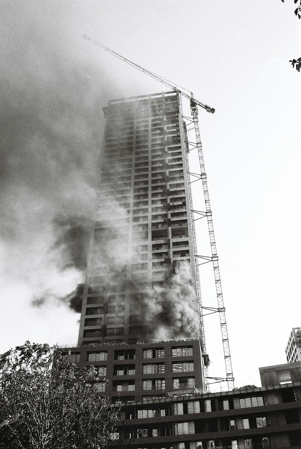 a tall building with a lot of smoke coming out of it