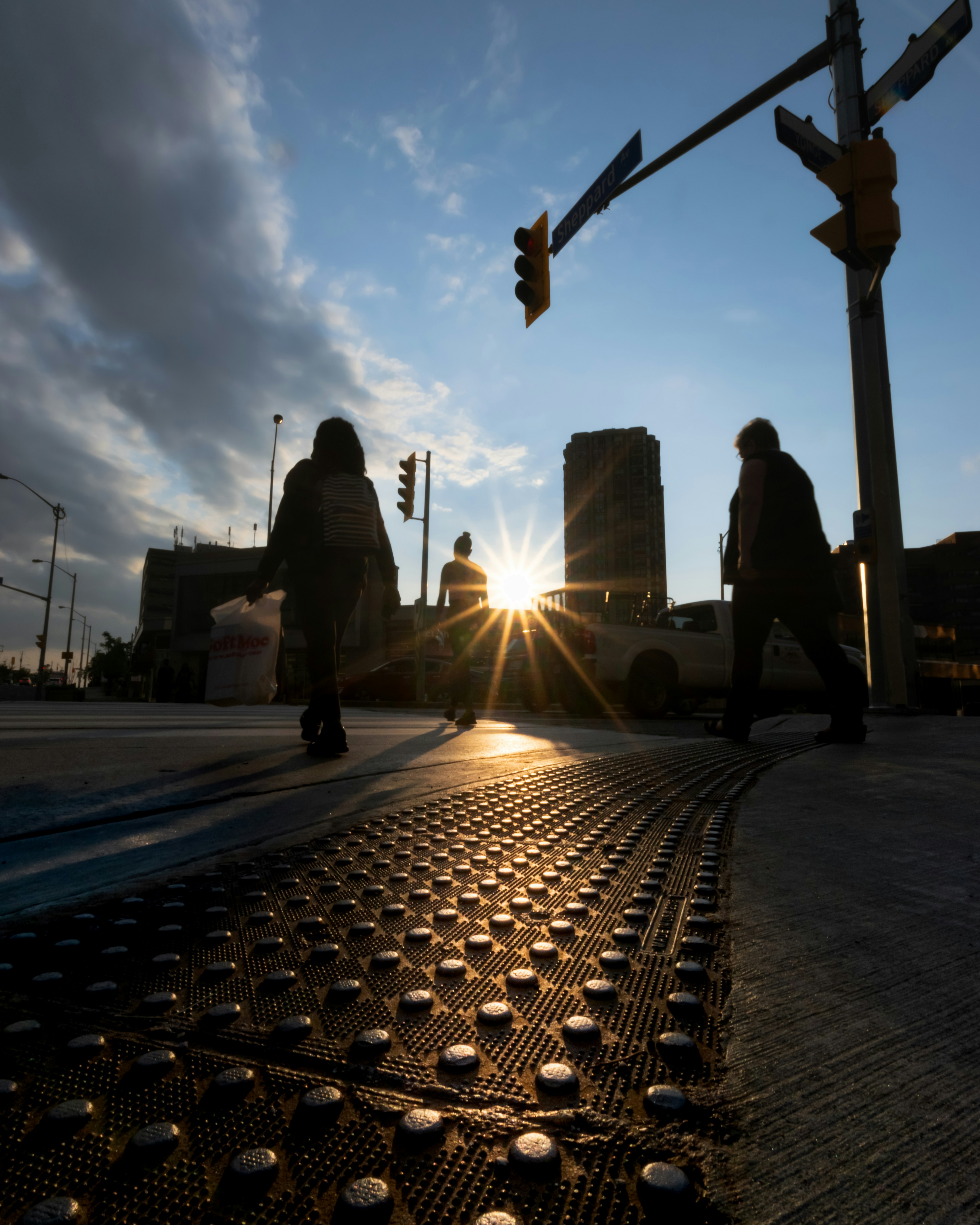 a couple of people walking across a street