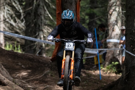A competitive downhill mountain biking race with intense action.