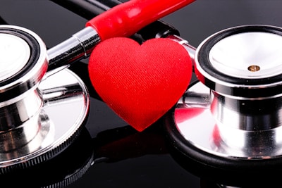 a stethoscope and a heart on a table