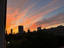 A cinematic frame capturing a dramatic sunset over Kyiv’s skyline during a film shoot.