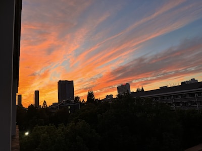 A cinematic frame capturing a dramatic sunset over Kyiv’s skyline during a film shoot.