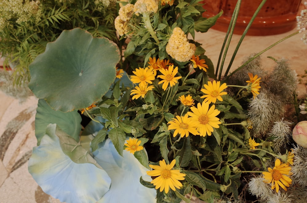 a bunch of flowers that are sitting on a table